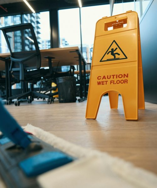 Cleaning with special mop in the modern office Cleaning with special mop in the modern office