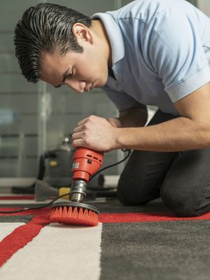 Laundry personnel cleaning carpet with special equipment Laundry personnel cleaning carpet with special equipment