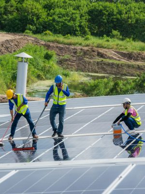 Solar power washing,labor working on cleaning solar panel at solar power plant. Solar power washing,labor working on cleaning solar panel at solar power plant.